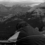 Boy looking at the Rocky Mountains.